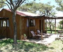 Cottage exterior, sunloungers and carport and solar geyser - Bee Tree Cottage