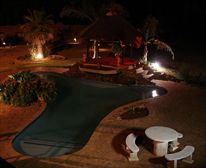 Pool at night. - Eden Guest Lodge