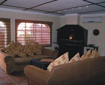 Fireplace. - El Gran Chaparral Guest House